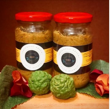 Jars of chutney served with fresh lime