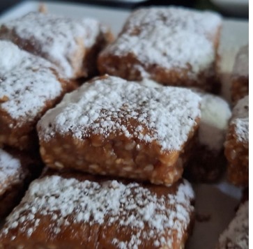 Fudgy brownie squares dusted with sugar