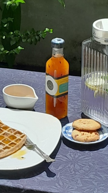 Fresh waffles served with rich golden syrup