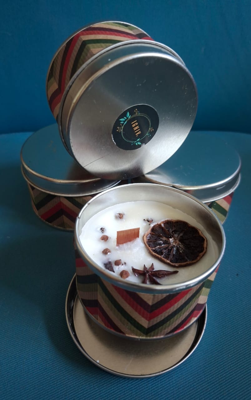 Chevron patterned candle tins, one open to show spices set in the wax